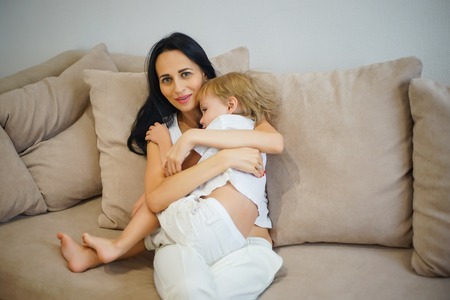 Closeup of happy mother and son playing at home. Weekend family leisure time concept.の写真素材