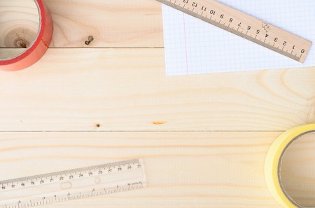 Workplace. School or office stationery on wooden board with copyspaceの写真素材