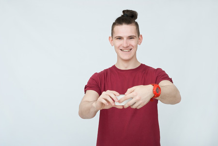 attractive emotional man in studio on backgroundの写真素材