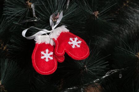 Handmade toy from felt on Christmas treeの写真素材