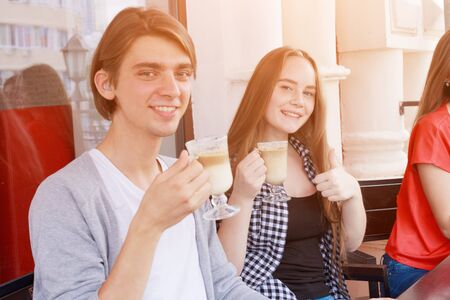 Happy easter A mother, and daughters painting Easter eggs. Happy family preparing for Easter.の写真素材