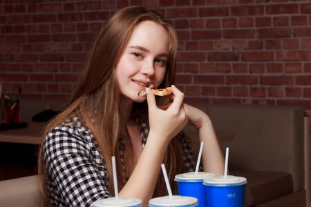 Happy easter A mother, and daughters painting Easter eggs. Happy family preparing for Easter.の写真素材