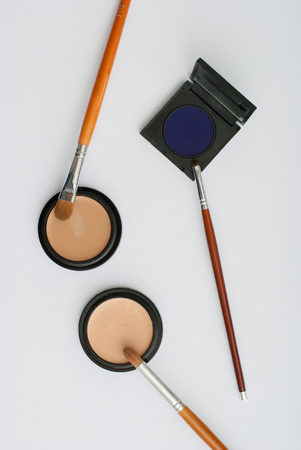 makeup brush and cosmetics, on a white background isolatedの写真素材