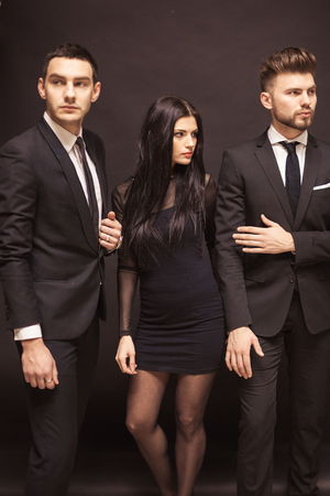 Beautiful female celebrity with bodyguardsの写真素材