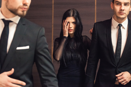 Beautiful female celebrity with bodyguards