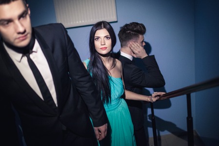 Beautiful female celebrity with bodyguardsの写真素材