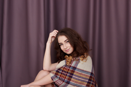 Girl Standing Near Window At Homeの写真素材