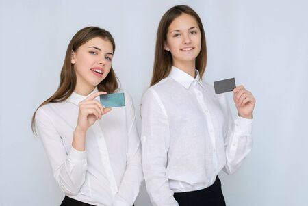Smiling business woman hold credit card. Isolated portraitの写真素材