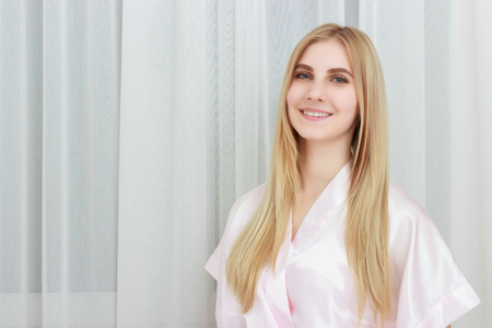 Beautiful Young Woman With Sexy Fit Body stand Curtainsの写真素材