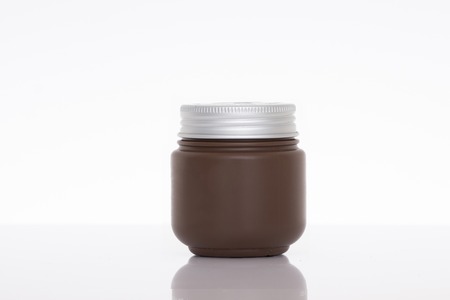 Jar of face cream isolated on white background with reflectionの写真素材