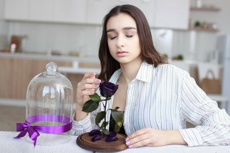 Young girl with flowerの写真素材
