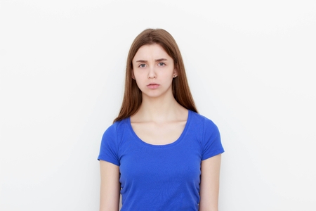 portrait sad unhappy woman isolated on white backgroundの写真素材