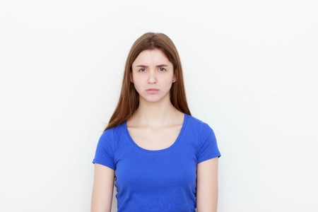 portrait sad unhappy woman isolated on white backgroundの写真素材