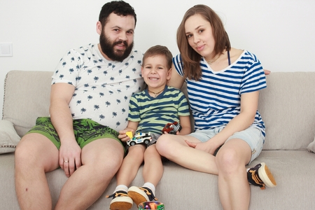 Family relaxing on sofaの写真素材