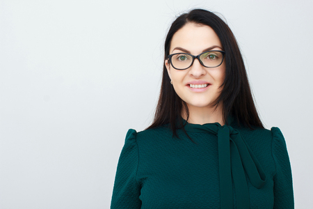 Middle-aged woman standing in modern homeの写真素材