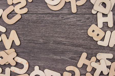 Wooden letters on wooden board backgroundの写真素材