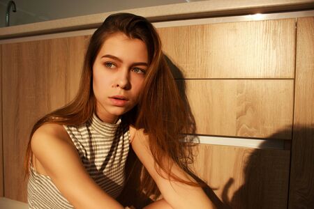 closeup fashion portriat of young model in sunset lightの写真素材