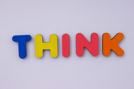 words from wooden letters on light grey background