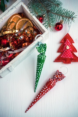Beautiful christmas background with colorful candies and decor on white wooden backgroundの写真素材