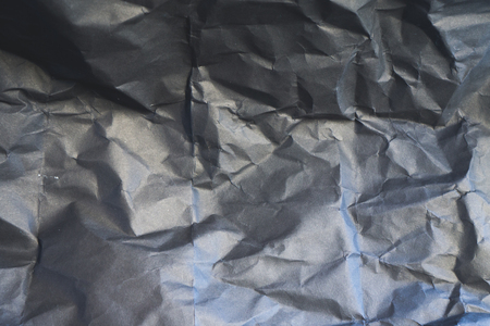 black wrinkled paper texture backgroundの写真素材