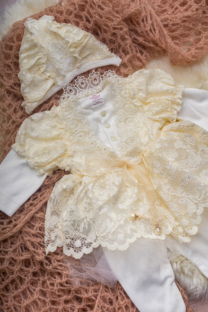 Flat lay photography of girl's smart outfits on soft pink wrapの写真素材