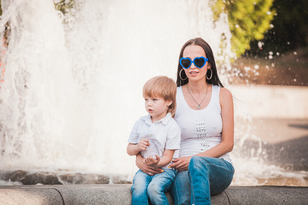 Happy mother with son outdoorの写真素材