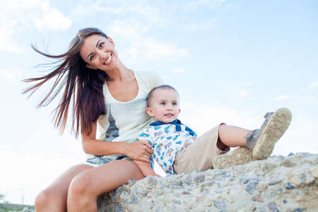 Happy mother with 2 years old son at vacation by the sea