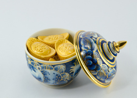 Gold ingot  Chinese on Benjarong White backgroundの写真素材