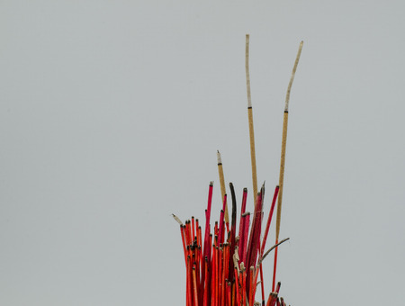 Incense burner and fire  on white backgroundの写真素材