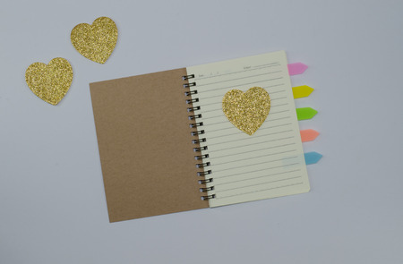 Recycled paper notebook open front cover on white backgroundの写真素材