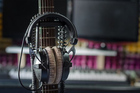 Earphones with neck guitar in the studio.の写真素材