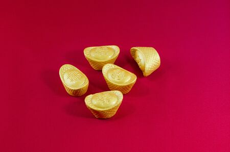 Wedge golden Gold ingot wedding Chinese  red backgroundの写真素材