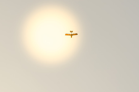 small plane flying in the sky