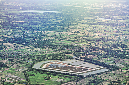 Aerial view of clouds over green land features in thaiの写真素材