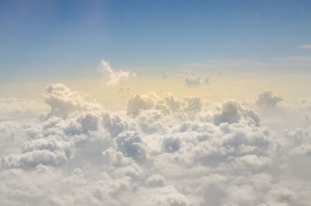 Clouds and sky high angle on the plane.