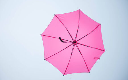 Hang on to the beautiful multicolored umbrellaの写真素材