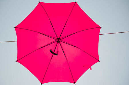 Hang on to the beautiful multicolored umbrellaの写真素材