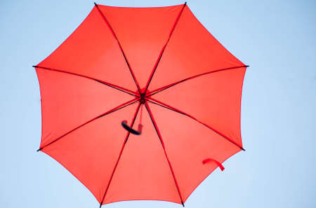 Hang on to the beautiful multicolored umbrellaの写真素材