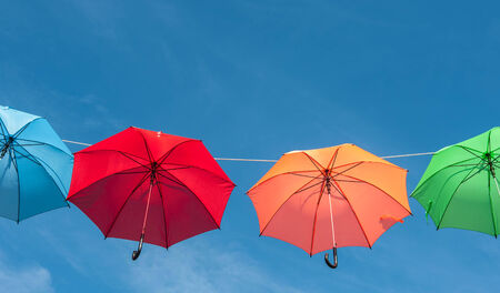 Hang on to the beautiful multicolored umbrellaの写真素材