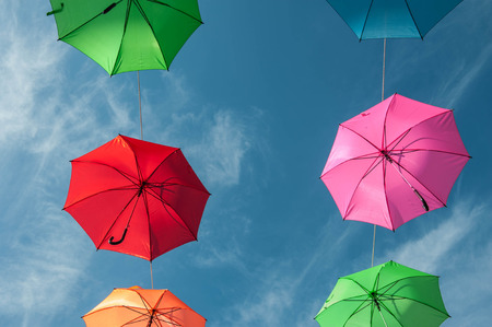 Streets are decorated with colorful umbrellas.の写真素材