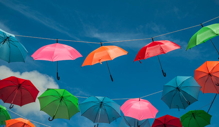 Streets are decorated with colorful umbrellas.の写真素材