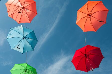Streets are decorated with colorful umbrellas.の写真素材