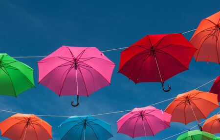 Streets are decorated with colorful umbrellas.の写真素材