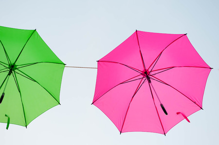 Streets are decorated with colorful umbrellas.の写真素材