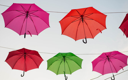Streets are decorated with colorful umbrellas.の写真素材