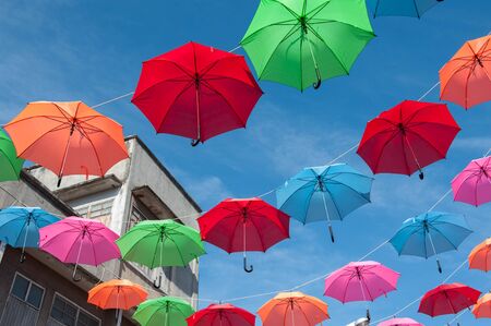 Streets are decorated with colorful umbrellas.の写真素材