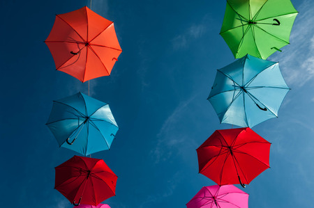 Streets are decorated with colorful umbrellas.の写真素材