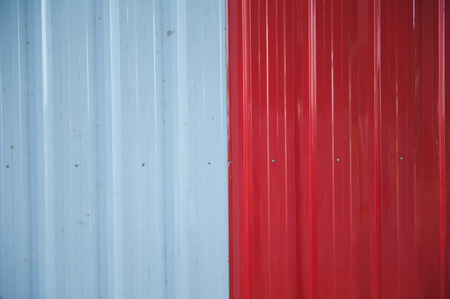 Zinc sheets adept use of temporary barrier walls.の写真素材