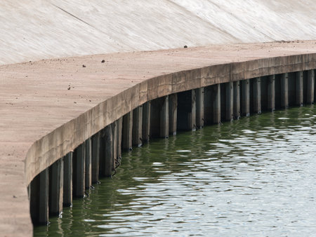 Concrete breakwaters on the river, close-up view.の写真素材