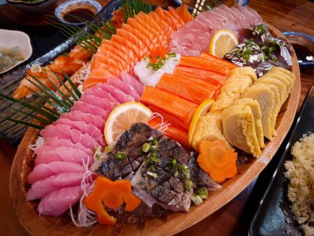 fresh sashimi set on wood dishの写真素材